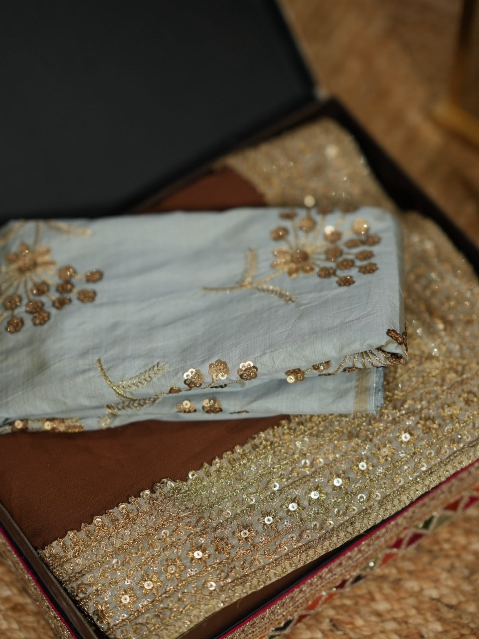 Dharani: Brown Georgette Saree with Steel Blue Raw Silk Blouse