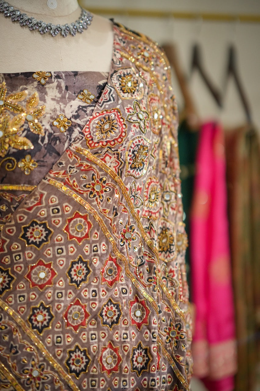 SAEBA: Brown Authentic Handblock Print Ajrakh Saree on Modal Satin with handwork on Saree and Blouse