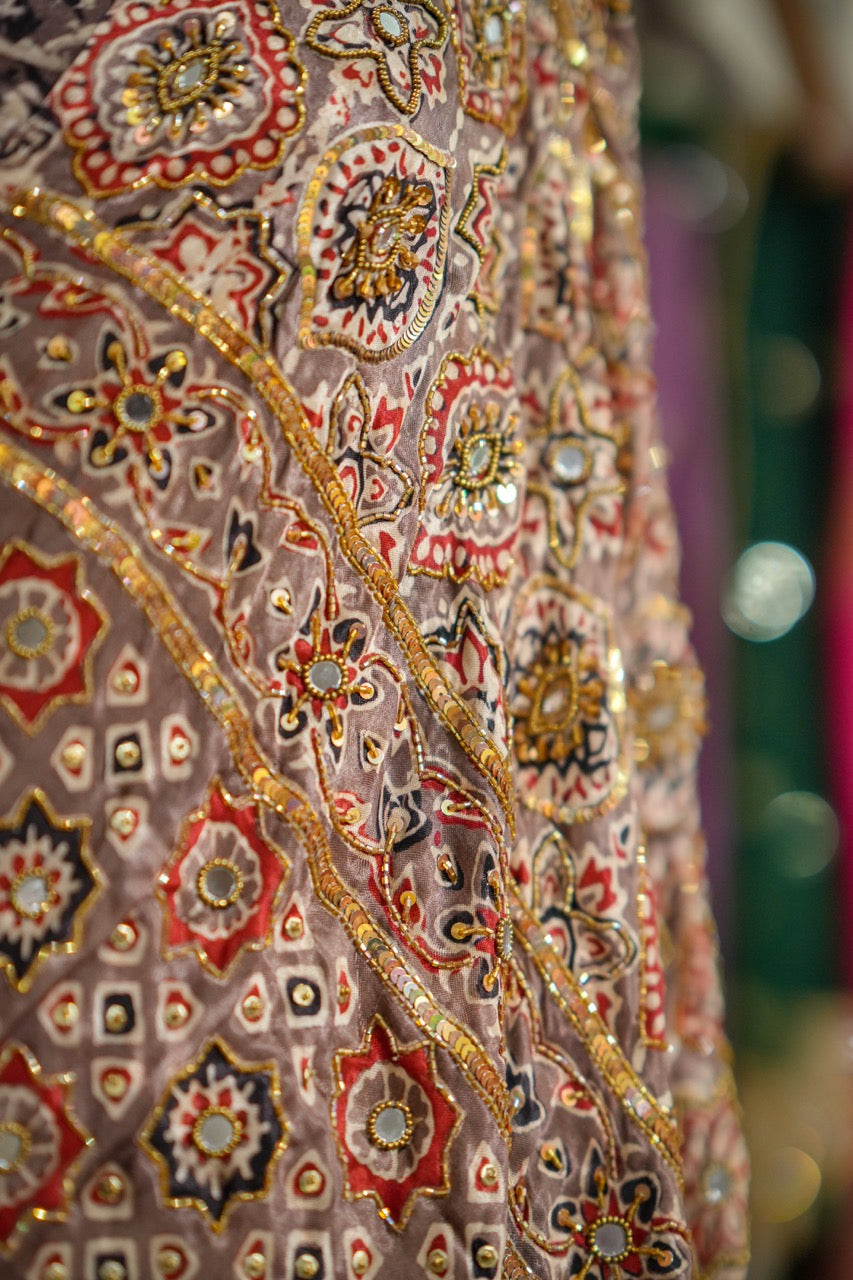SAEBA: Brown Authentic Handblock Print Ajrakh Saree on Modal Satin with handwork on Saree and Blouse