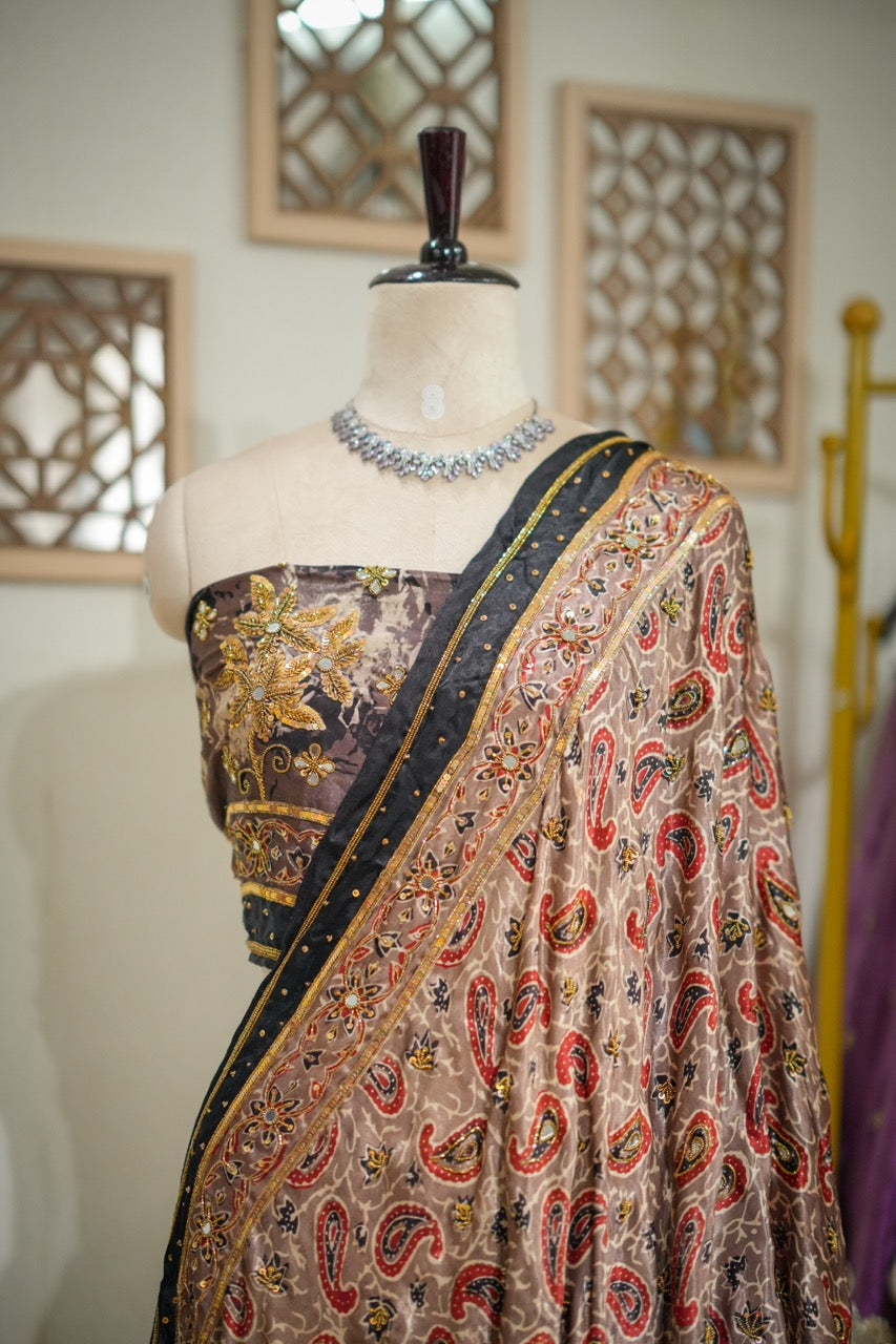 SAEBA: Brown Authentic Handblock Print Ajrakh Saree on Modal Satin with handwork on Saree and Blouse