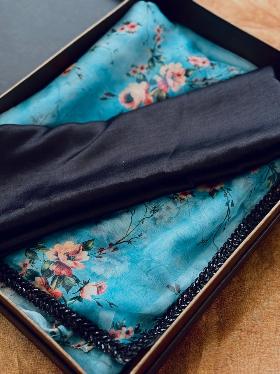Chaandni: Blue Floral Print Cleopatra Chiffon Saree with Black Premium Satin Blouse