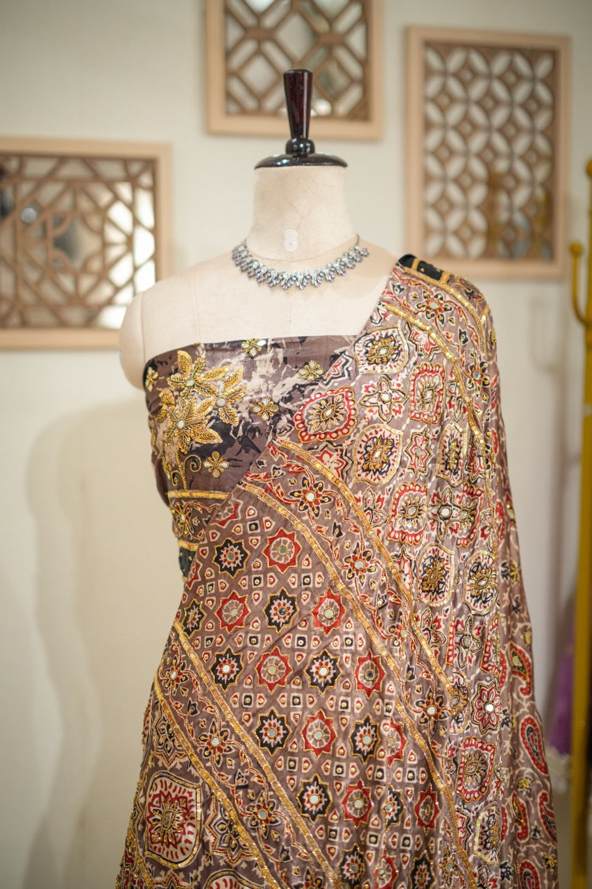 SAEBA: Brown Authentic Handblock Print Ajrakh Saree on Modal Satin with handwork on Saree and Blouse